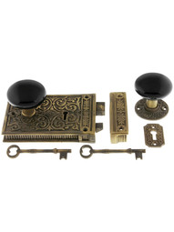 Solid Brass Scroll Rim Lock Set with Black Porcelain Door Knobs.